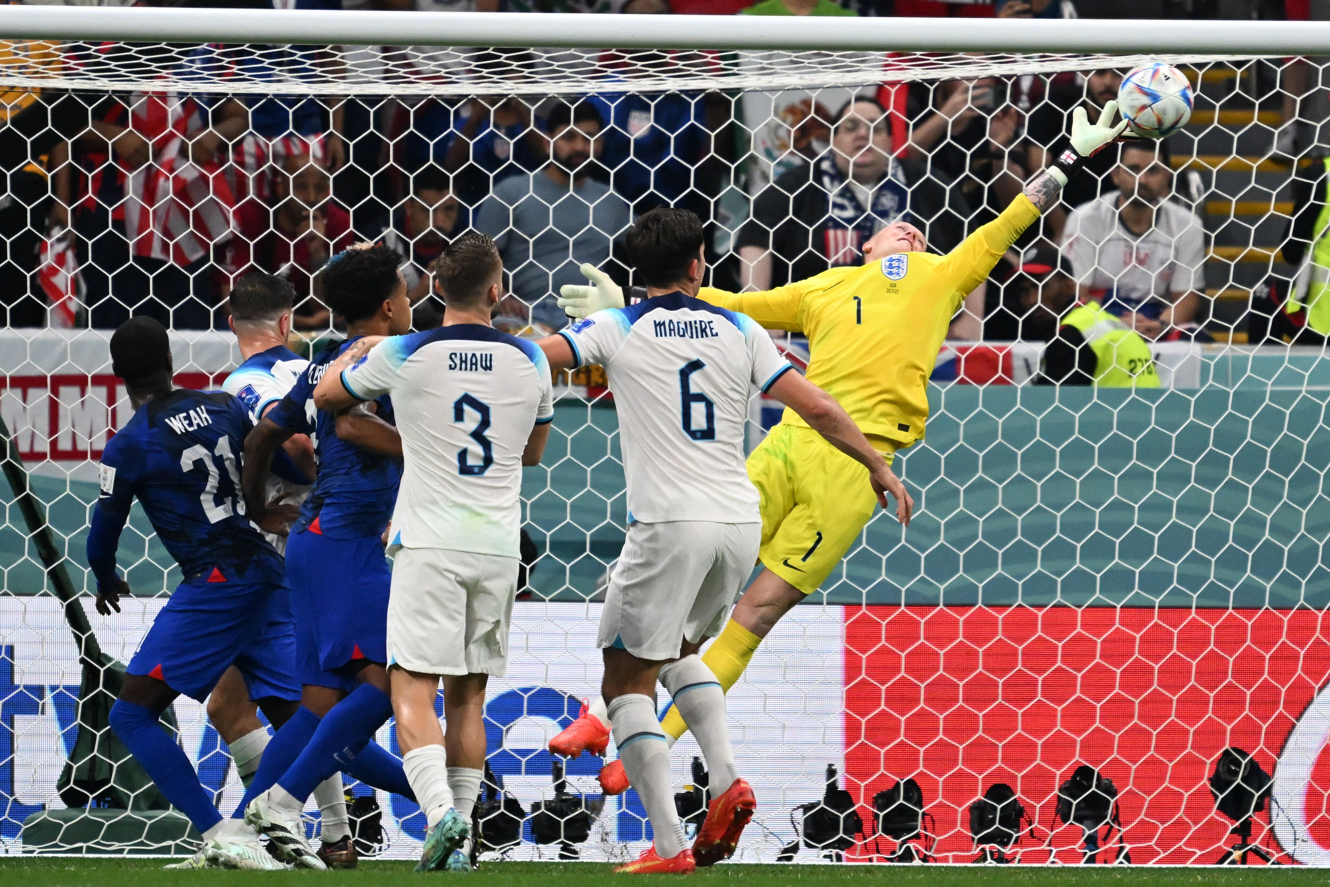 England goalkeeper Jordan Pickford makes a save against the USMNT.