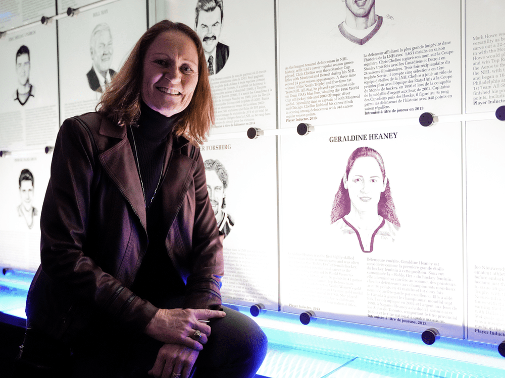 1/29/23 Toronto Six head coach and Hockey Hall of Famer Geraldine Heaney is sitting in front of her plaque at the HOF in Toronto, Ontario, Canada. (Photo Credit: Nathan Fernandes)