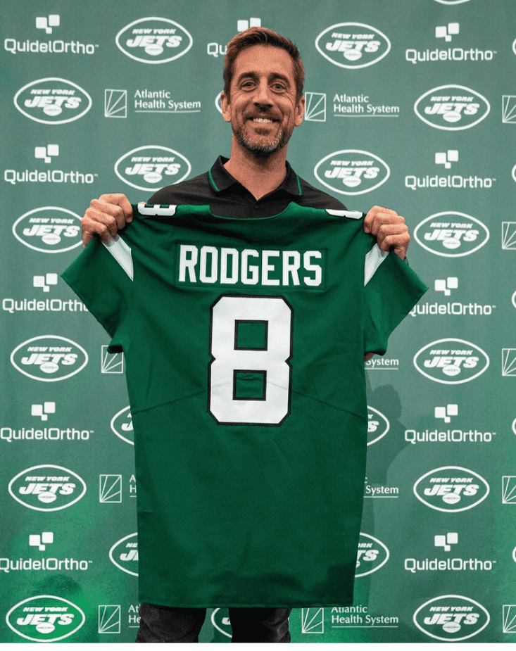 New York Jets newest Quaterback Rodgers (8) displays his new uniform number as he won't wear number 12 anymore now that he is a Jets' quarterback.