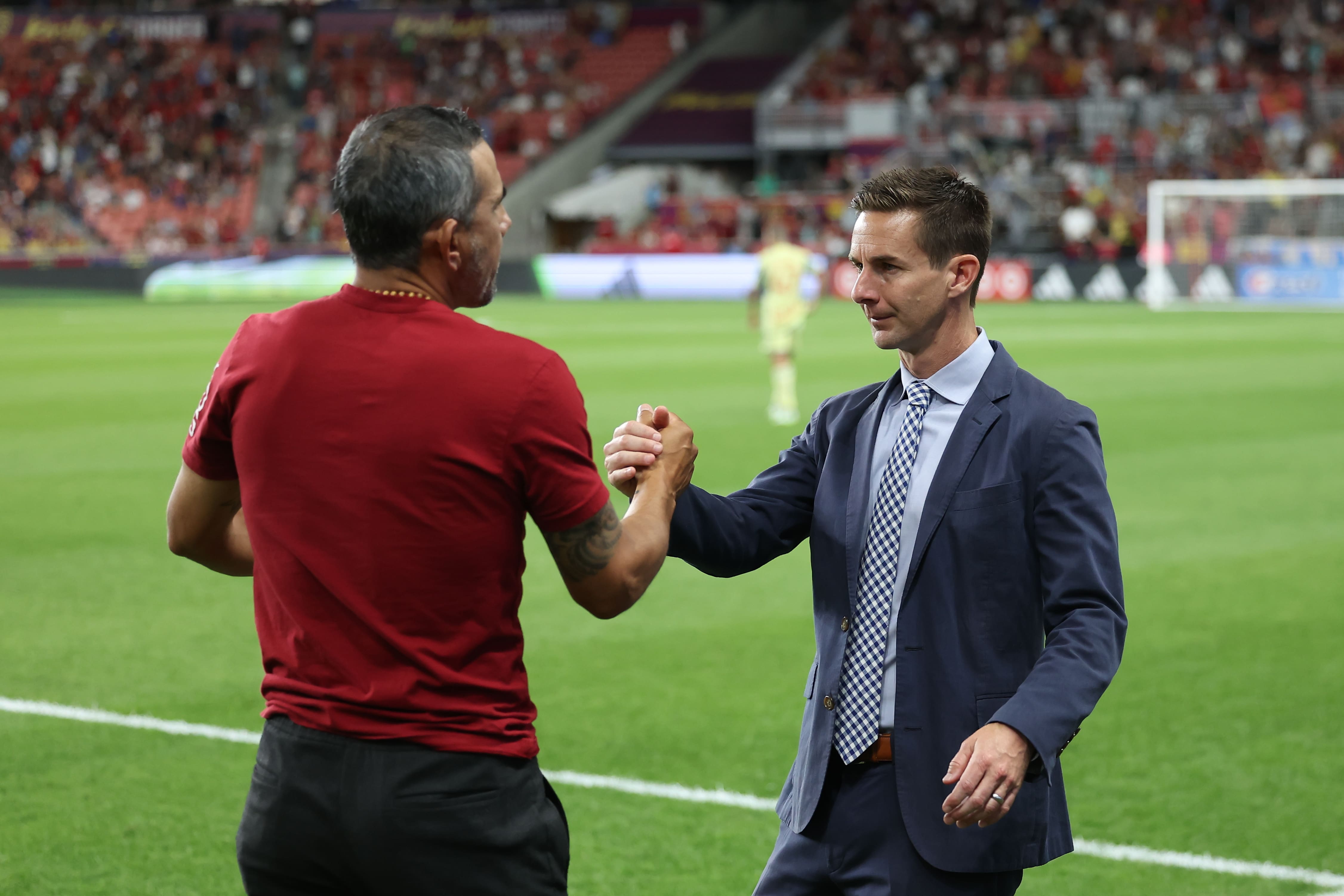 Jul 15, 2023; Sandy, Utah, USA; Real Salt Lake head coach Pablo Mastroeni (left) and New York Red Bulls head coach Troy Lesesne shake hands after a match at America First Field. Mandatory Credit: Rob Gray-USA TODAY Sports
