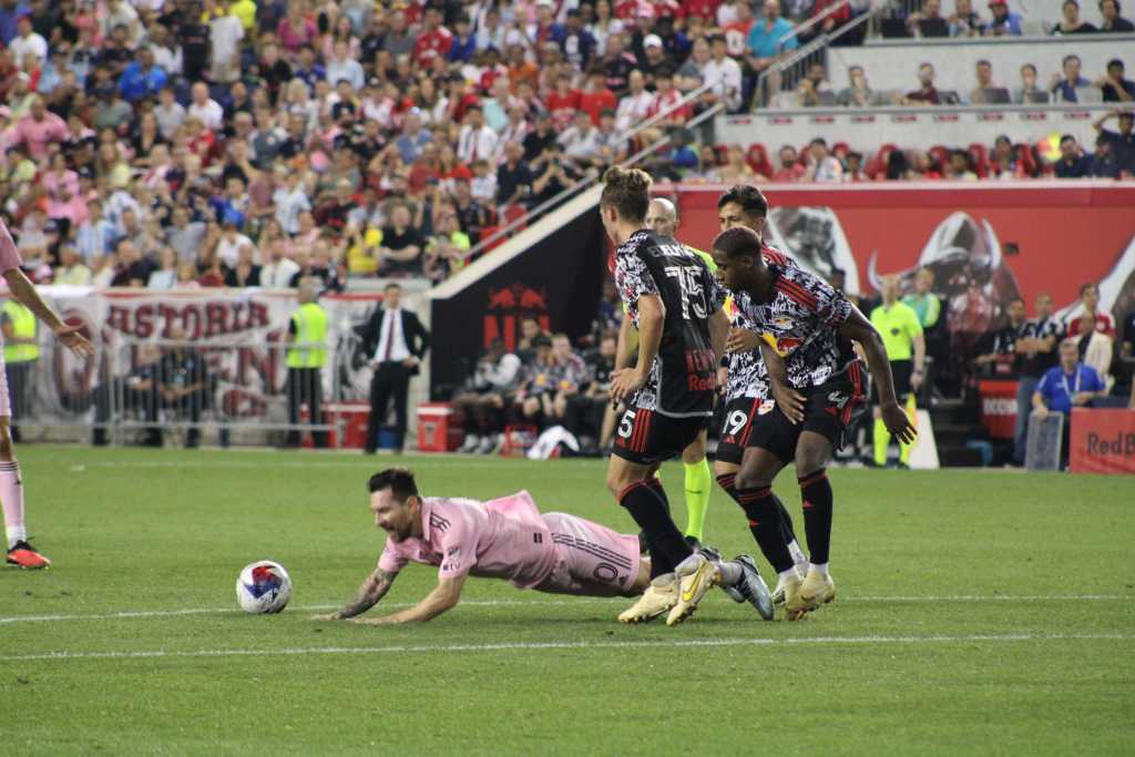 Inter Miami's Leo Messi fouled hard by New York Red Bulls CDM Daniel Edelman at the top of the box. 