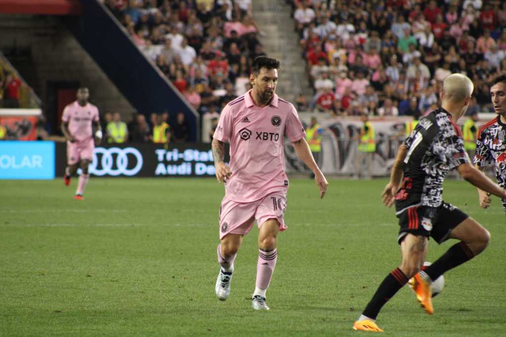 Inter Miami star Leo Messi battles with NY Red Bulls John Tolkin.