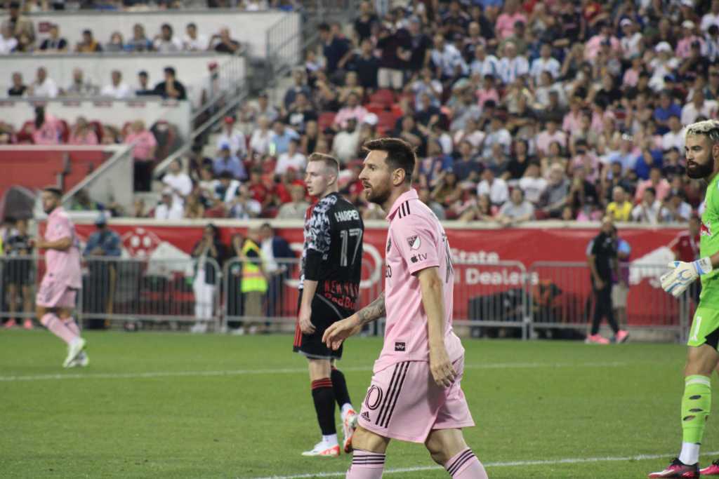 Inter Miami star Leo Messi walking back to midfield after scoring chance. 