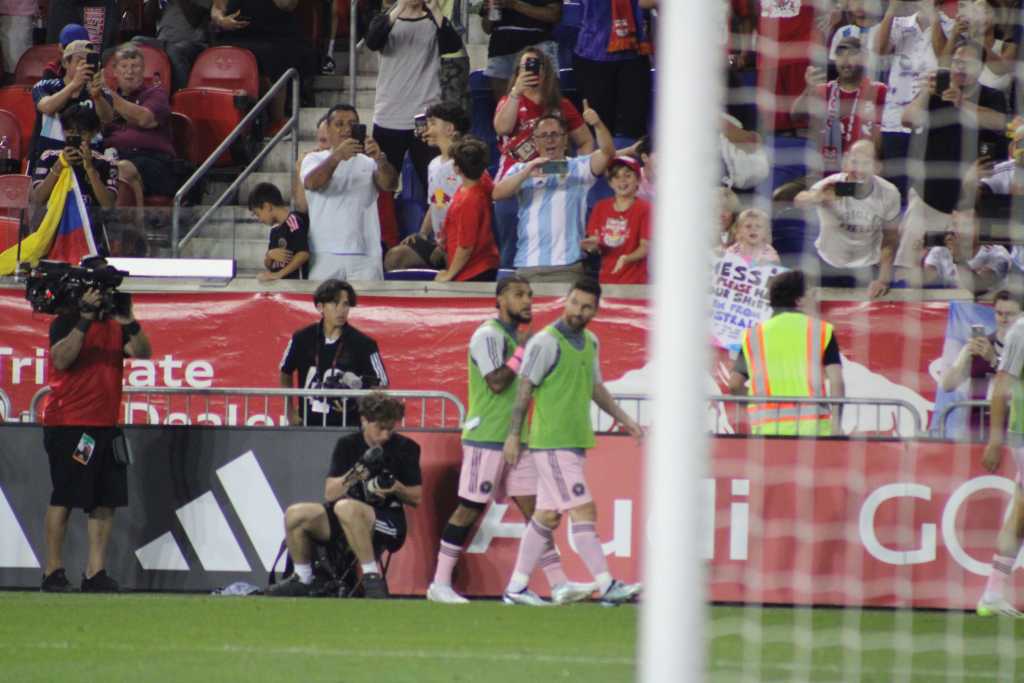 Inter Miami's star Leo Messi warming up on the touchline. 