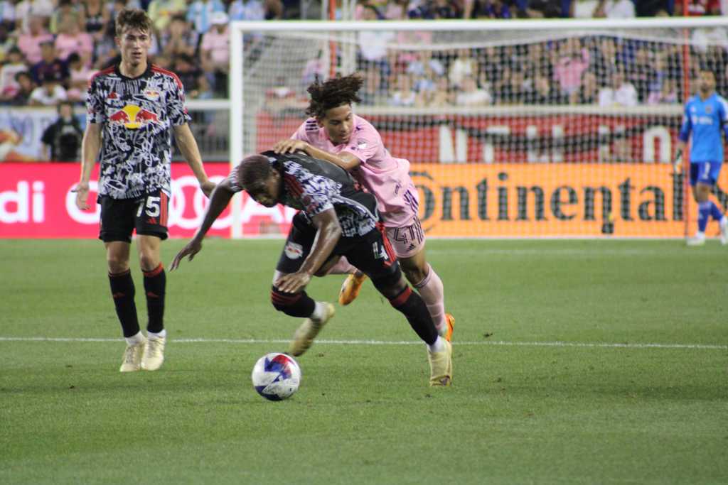 NY Red Bulls wing back Kyle Duncan going to ground during battle for ball. 