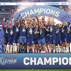 U.S. Men's National team celebrates their Finals victory on stage together with the trophy and confetti.
