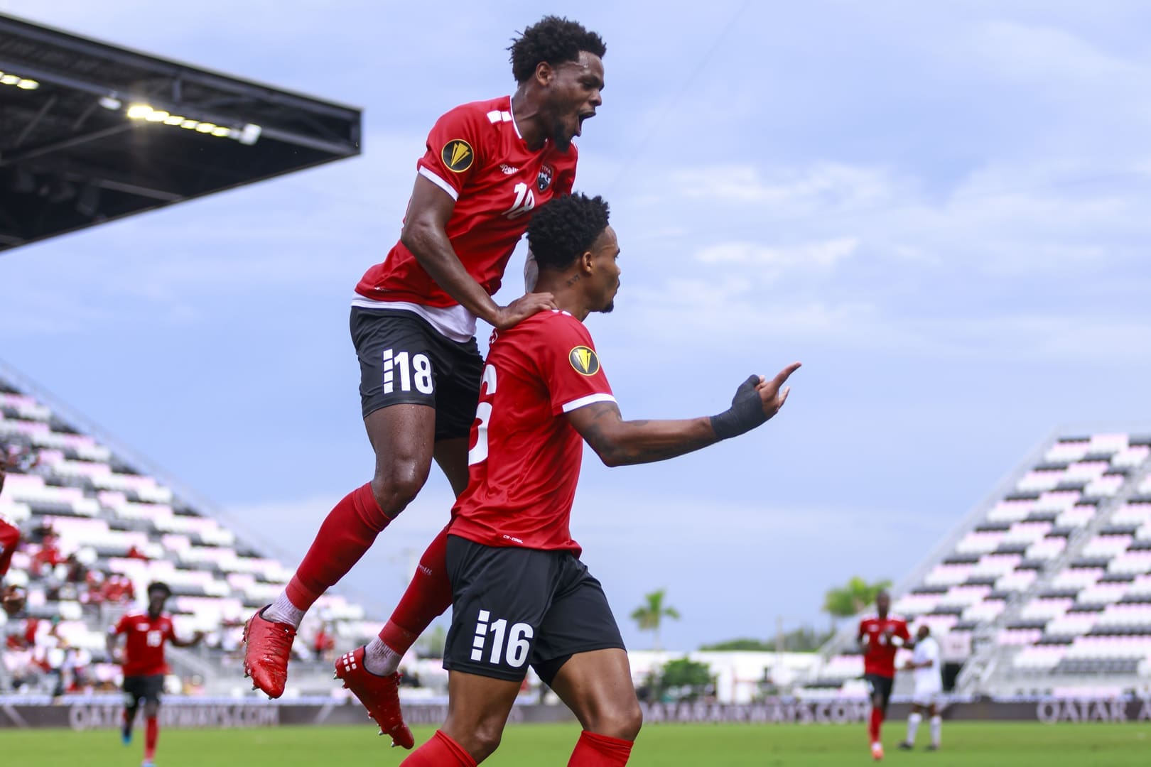 Trinidad and Tobago players celebrate goal during dominant 3-0 Gold Cup victory over Saint Kitts and Nevis at DRV PNK Stadium