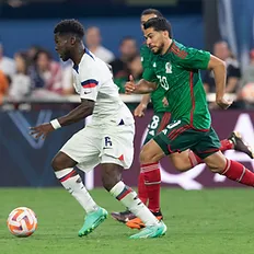 Yunus Musah dribbling past a Mexican defender. Credit: Concacaf.com