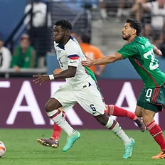 Yunus Musah dribbling past a Mexican defender, getting fouled. Credit: Concacaf.com