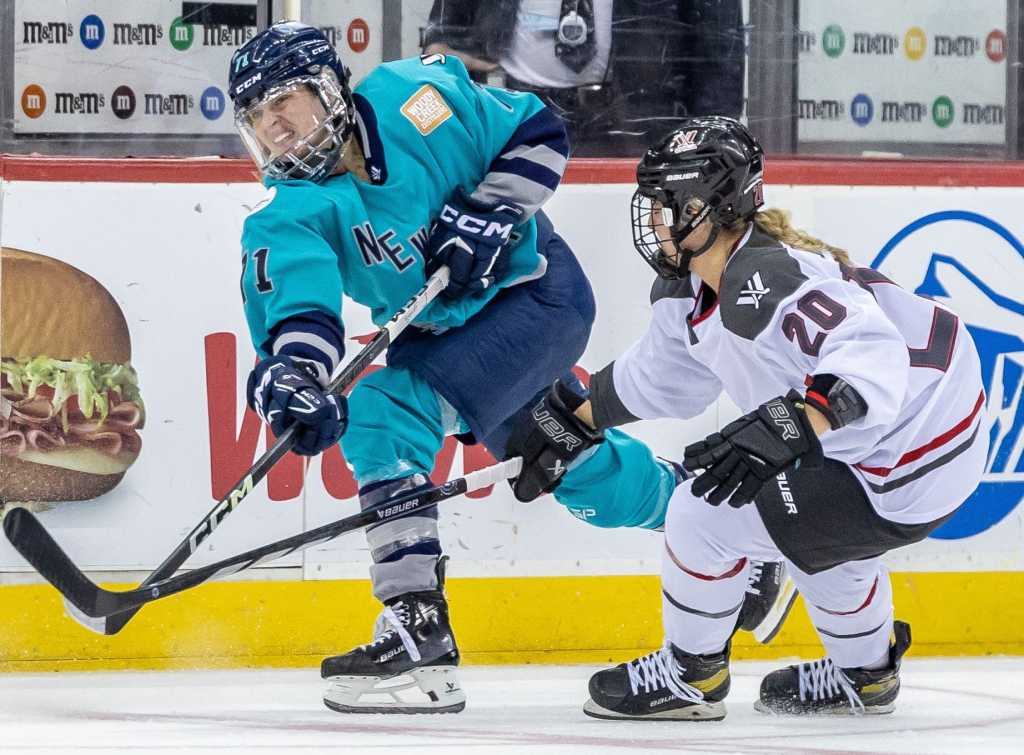 5/3/24 Battle along the boards between New York and Ottawa. Mandatory Credit: PWHL