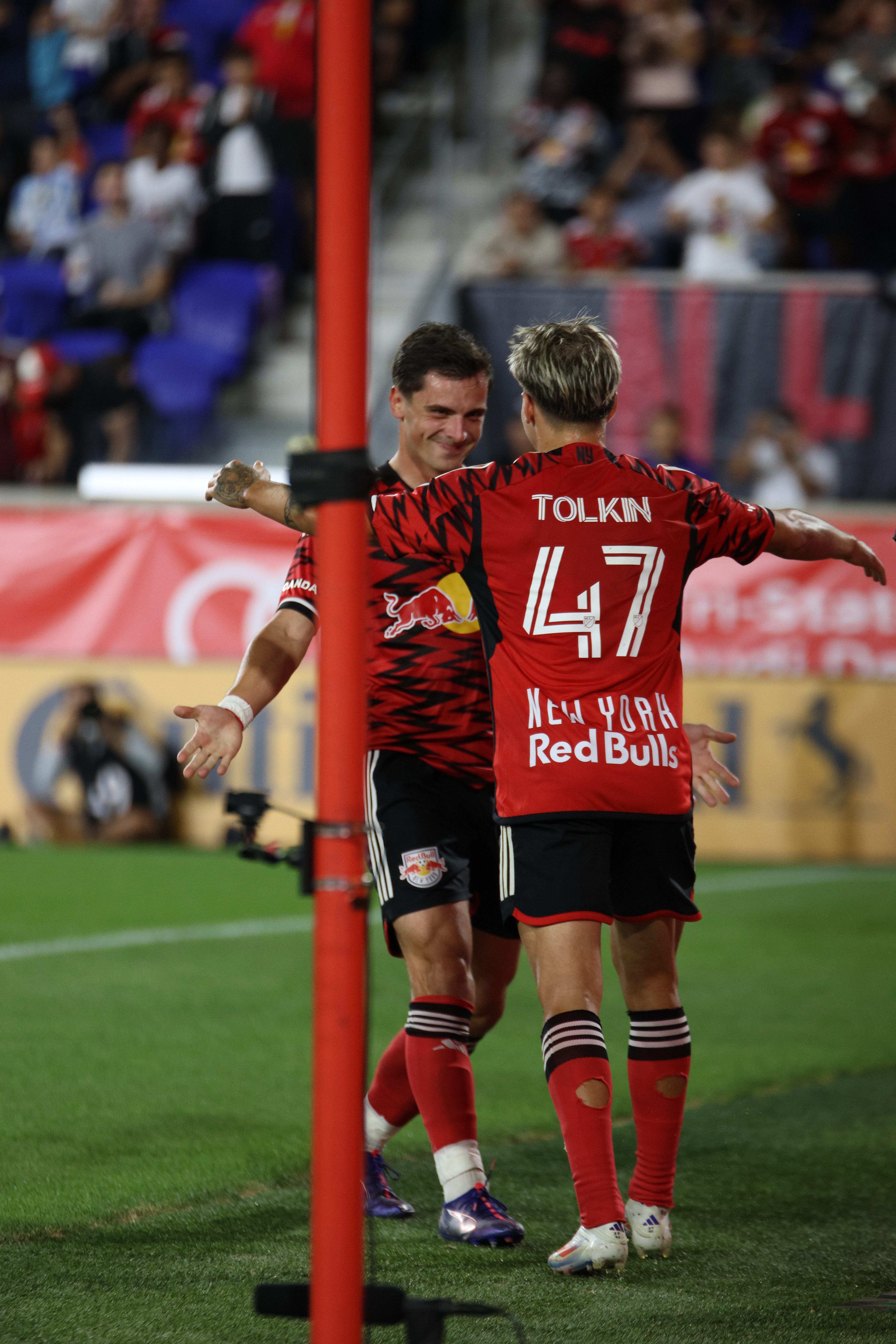 John "JMi" Tolkin embraces Dante Vanzeir after Dante's opening goal against Atlanta. 9/21/24 Red Bull Arena| Mandatory Photo Credit: Jose Pichirilo/Bad Dawg Sports