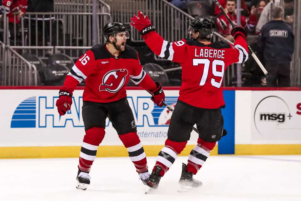 Samuel Laberge embraces Nathan Legare after doubling the Devils lead in the first period