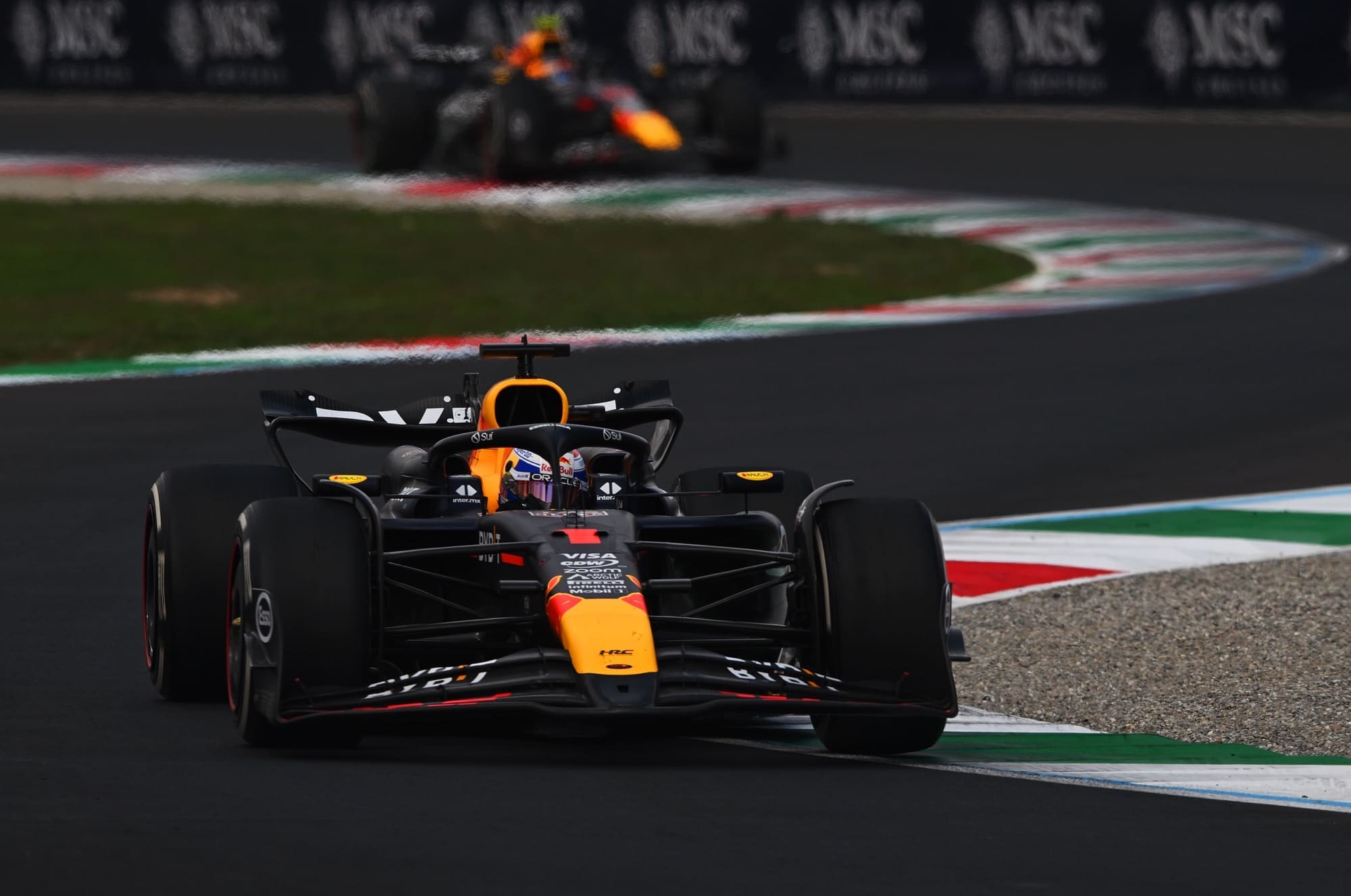 MONZA, ITALY - SEPTEMBER 01: Max Verstappen of the Netherlands driving the (1) Oracle Red Bull Racing RB20 leads Sergio Perez of Mexico driving the (11) Oracle Red Bull Racing RB20 during the F1 Grand Prix of Italy at Autodromo Nazionale Monza on September 01, 2024 in Monza, Italy. (Photo by Rudy Carezzevoli/Getty Images)