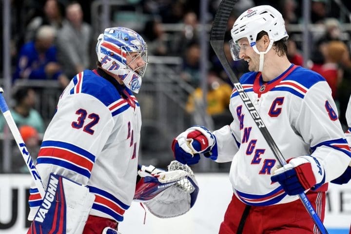 Jacob Trouba congratulating Jonathan Quick on a road win. Mandatory Credit: New York Rangers Comms