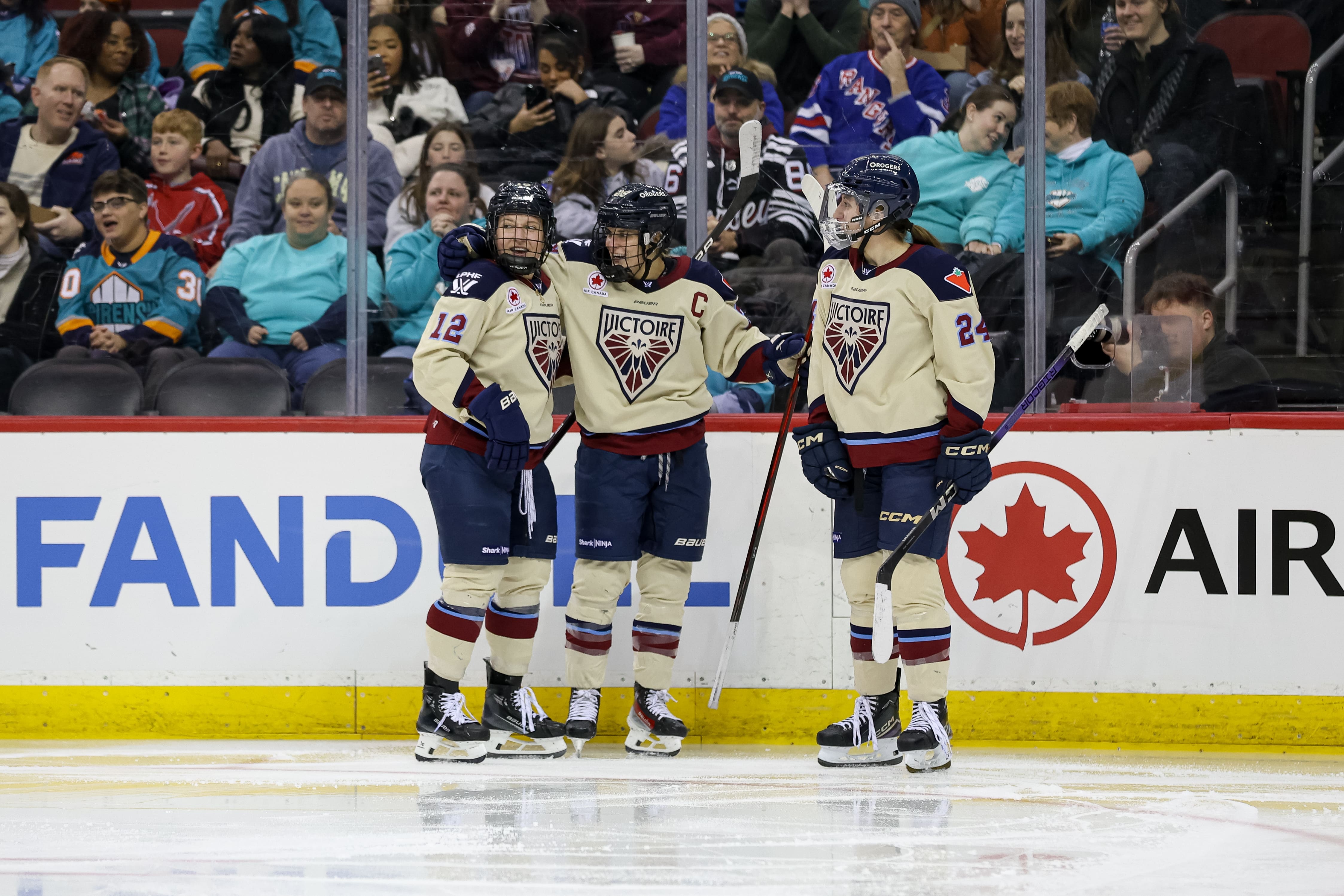 2/2/25 Newark, NJ Prudential Center|MArie Philip-Poulin Celebrates her second goal of the game with her teammates. Mandatory Credit: Nala Burton/NY Sirens/The PWHL