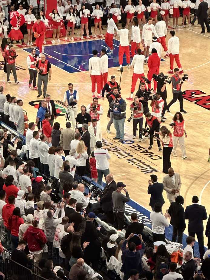 3/1/25 New York City, NY Madison Square Garden| Rick Pitino enters the court showing off his "Drip" wearing a sharp white suit on white-out day. Mandatory Credit: Bad Dawg Sports/JJ Pavlick