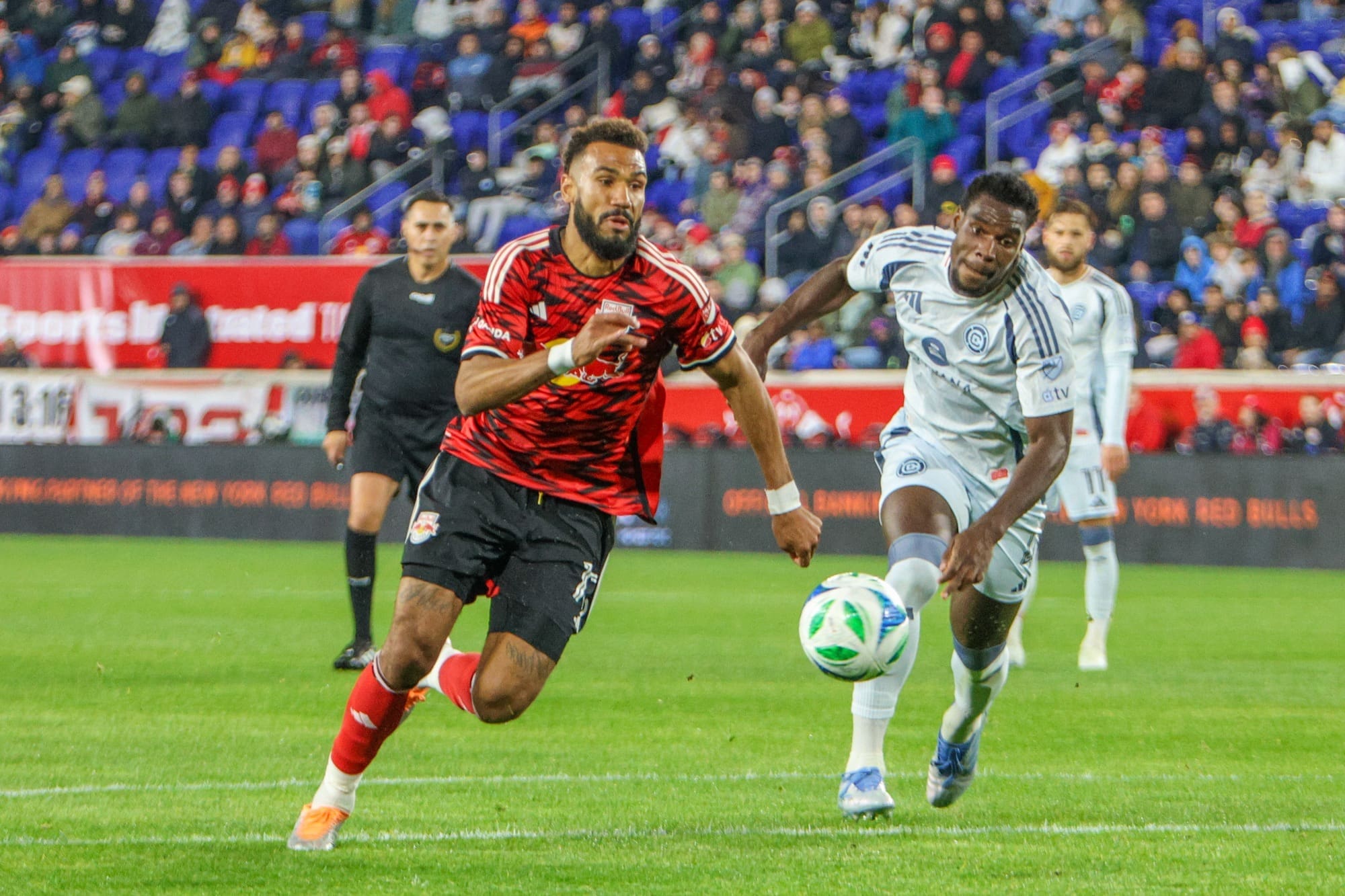 4/05/25, Harrison, New Jersey, Sports Illustrated Stadium, #13 Eric Maxim Choupo-Moting of New York Redbull out paces #4 Chicago Fire Carlos Carlos Terán. Jose Pichirilo /Bad Dawg Sports