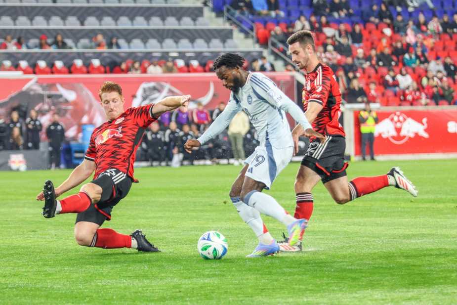 4/05/25, Harrison, New Jersey, Sports Illustrated Stadium, Jonathan Bamba #19 of Chicago Fire controls the ball under pressure from Tim Parker #26 and Dylan Nealis #12 of New York Redbulls. Jose Pichirilo /Bad Dawg Sports