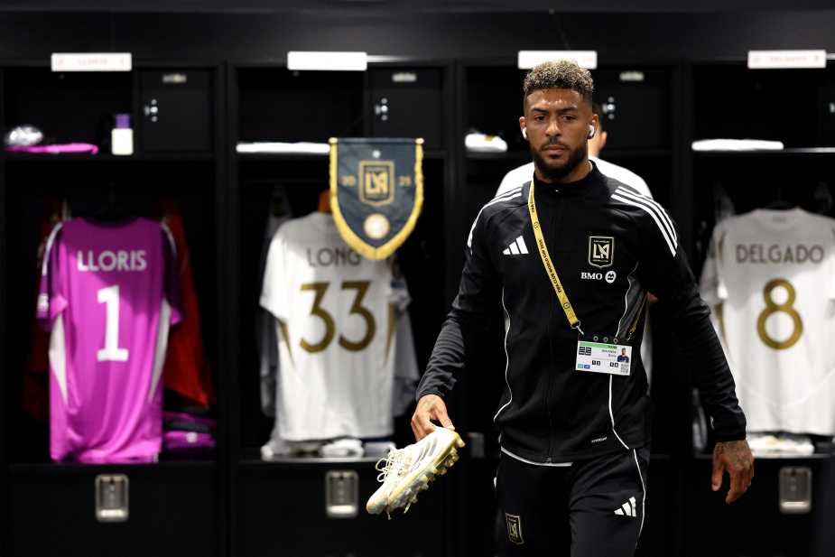 NASHVILLE, TENNESSEE - JUNE 20: Denis Bouanga #99 of LAFC holds his cleats in the dressing room prior to the FIFA Club World Cup 2025 group D match between Los Angeles Football Club and Esperance de Tunis at GEODIS Park on June 20, 2025 in Nashville, Tennessee. (Photo by Stuart Franklin - FIFA/FIFA via Getty Images)