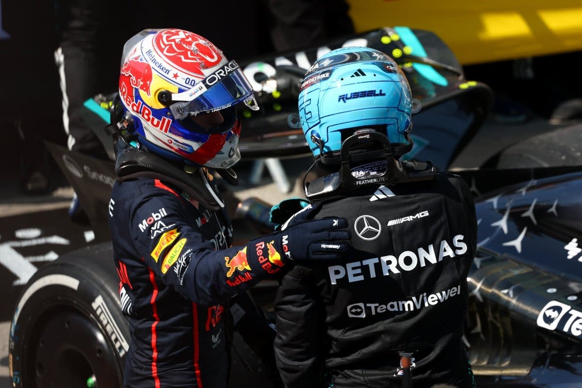 6/15/25 Max Verstappen and George Russell talking after their one-two finish without any events between the two drivers. Mandatory Credit: F1