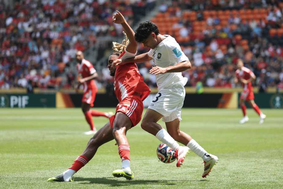 CINCINNATI, OHIO - JUNE 15: Sacha Boey #23 of FC Bayern Munchen is challenged by Adam Mitchell #3 of Auckland City FC during the FIFA Club World Cup 2025 group C match between FC Bayern München and Auckland City FC at TQL Stadium on June 15, 2025 in Cincinnati, Ohio. (Photo by Stuart Franklin - FIFA/FIFA via Getty Images)