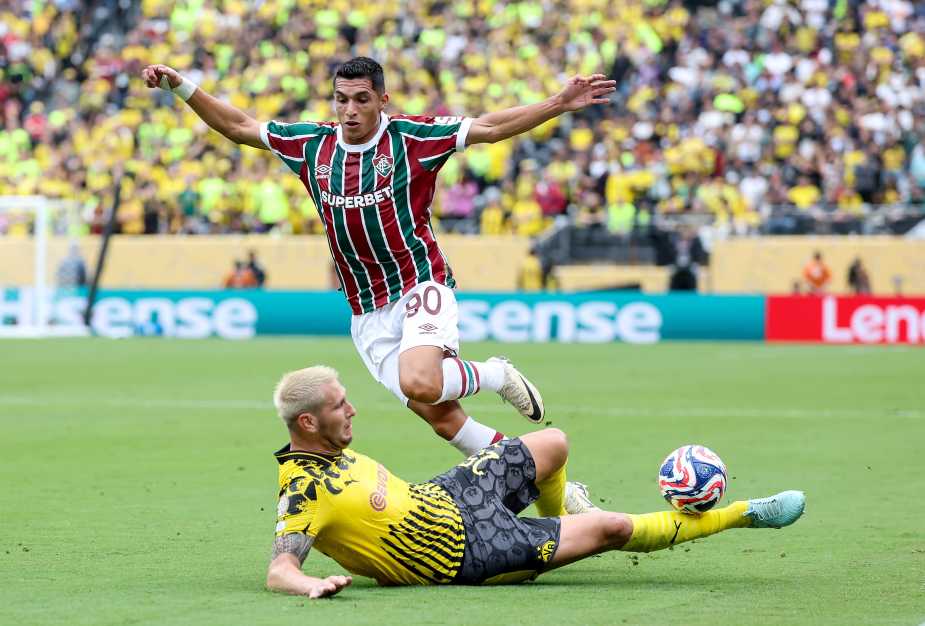 EAST RUTHERFORD, NEW JERSEY - JUNE 17: Kevin Serna #90 of Fluminense FC is tackled by Niklas Suele #25 of Borussia Dortmund during the FIFA Club World Cup 2025 group F match between Fluminense FC and Borussia Dortmund at MetLife Stadium on June 17, 2025 in East Rutherford, New Jersey. (Photo by Elsa - FIFA/FIFA via Getty Images)