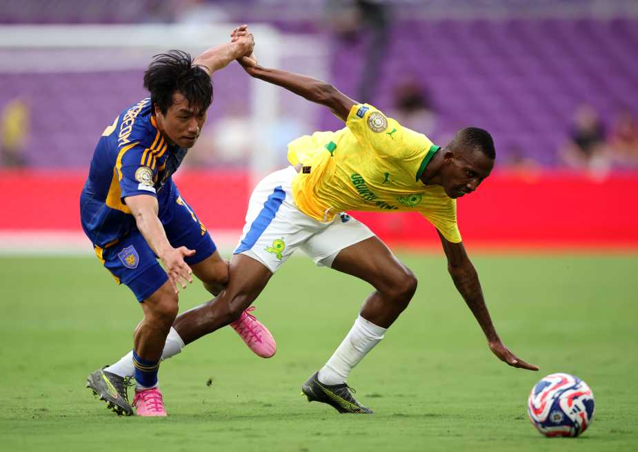 ORLANDO, FLORIDA - JUNE 17: Divine Lunga #29 of Mamelodi Sundowns FC is tackled by Ko Seungbeom #7 of Ulsan HD during the FIFA Club World Cup 2025 group F match between Ulsan HD FC and Mamelodi Sundowns FC at Inter&Co Stadium on June 17, 2025 in Orlando, Florida. (Photo by Hector Vivas - FIFA/FIFA via Getty Images)