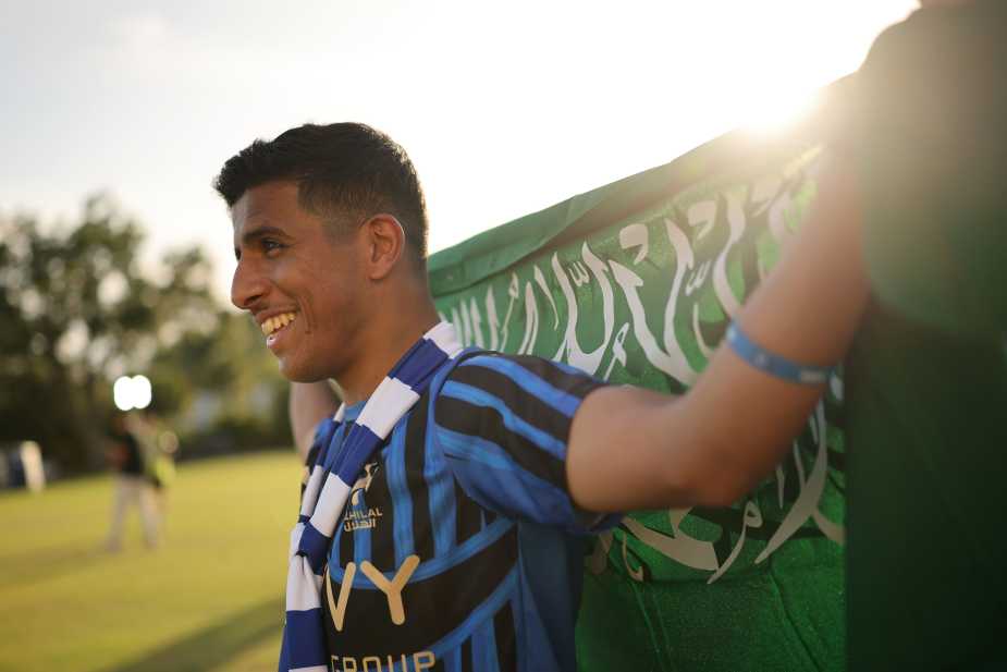 ORLANDO, FLORIDA - JUNE 30: An Al Hilal fan holds a flag before the FIFA Club World Cup 2025 round of 16 match between Manchester City and Al-Hilal at Camping World Stadium on June 30, 2025, in Orlando, Florida. (Photo by Hector Vivas - FIFA/FIFA via Getty Images)