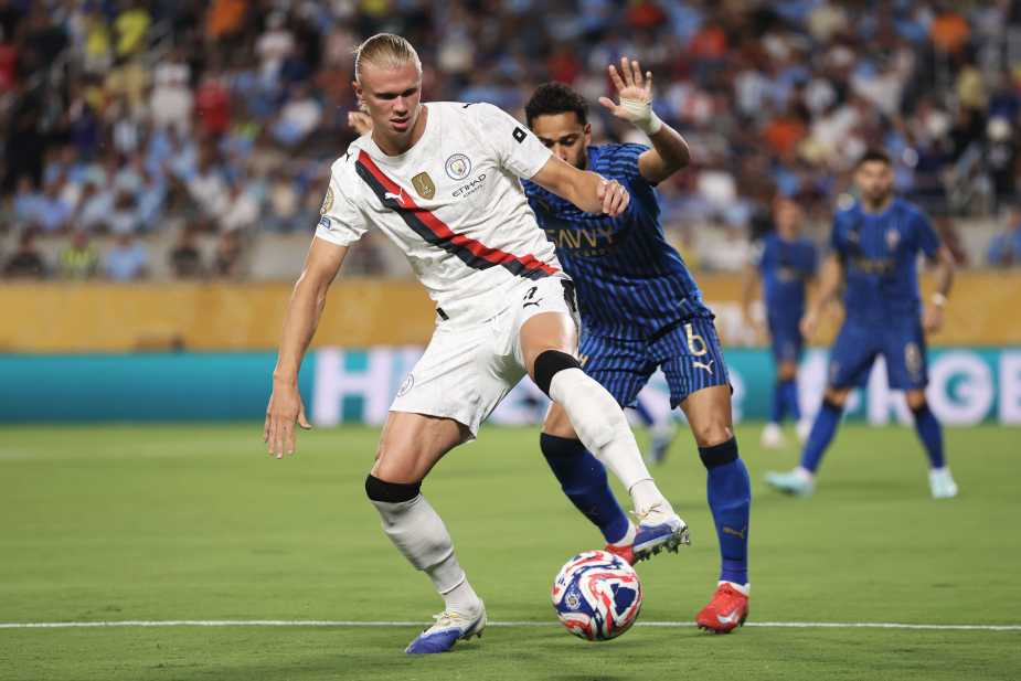ORLANDO, FLORIDA - JUNE 30: Erling Haaland #9 of Manchester City is challenged by Renan Lodi #6 of Al Hilal during the FIFA Club World Cup 2025 round of 16 match between Manchester City and Al-Hilal at Camping World Stadium on June 30, 2025 in Orlando, Florida. (Photo by Justin Setterfield - FIFA/FIFA via Getty Images)