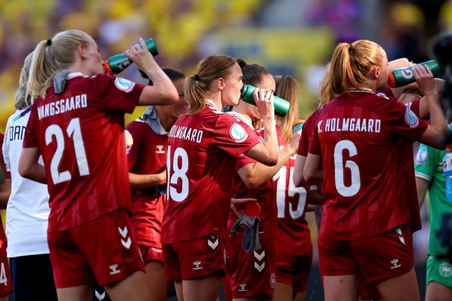 GENEVA, SWITZERLAND - JULY 04: Sara Holmgaard of Denmark pauses for a drinks break with teammates during the UEFA Women's EURO 2025 Group C match between Denmark and Sweden at Stade de Geneve on July 04, 2025 in Geneva, Switzerland. (Photo by Molly Darlington - UEFA/UEFA via Getty Images)