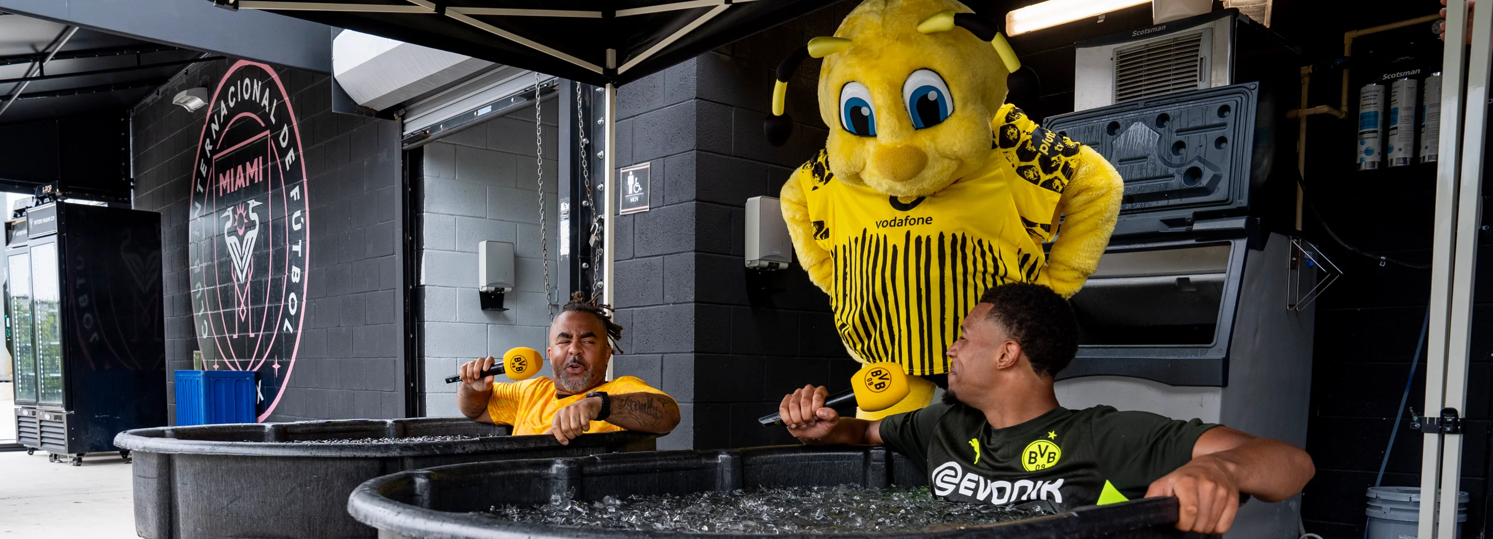 6/30/25 Emma is watching over OWO and Felix Nmecha during the Ice Bath Interview. Mandatory Credit: BVB Dortmund