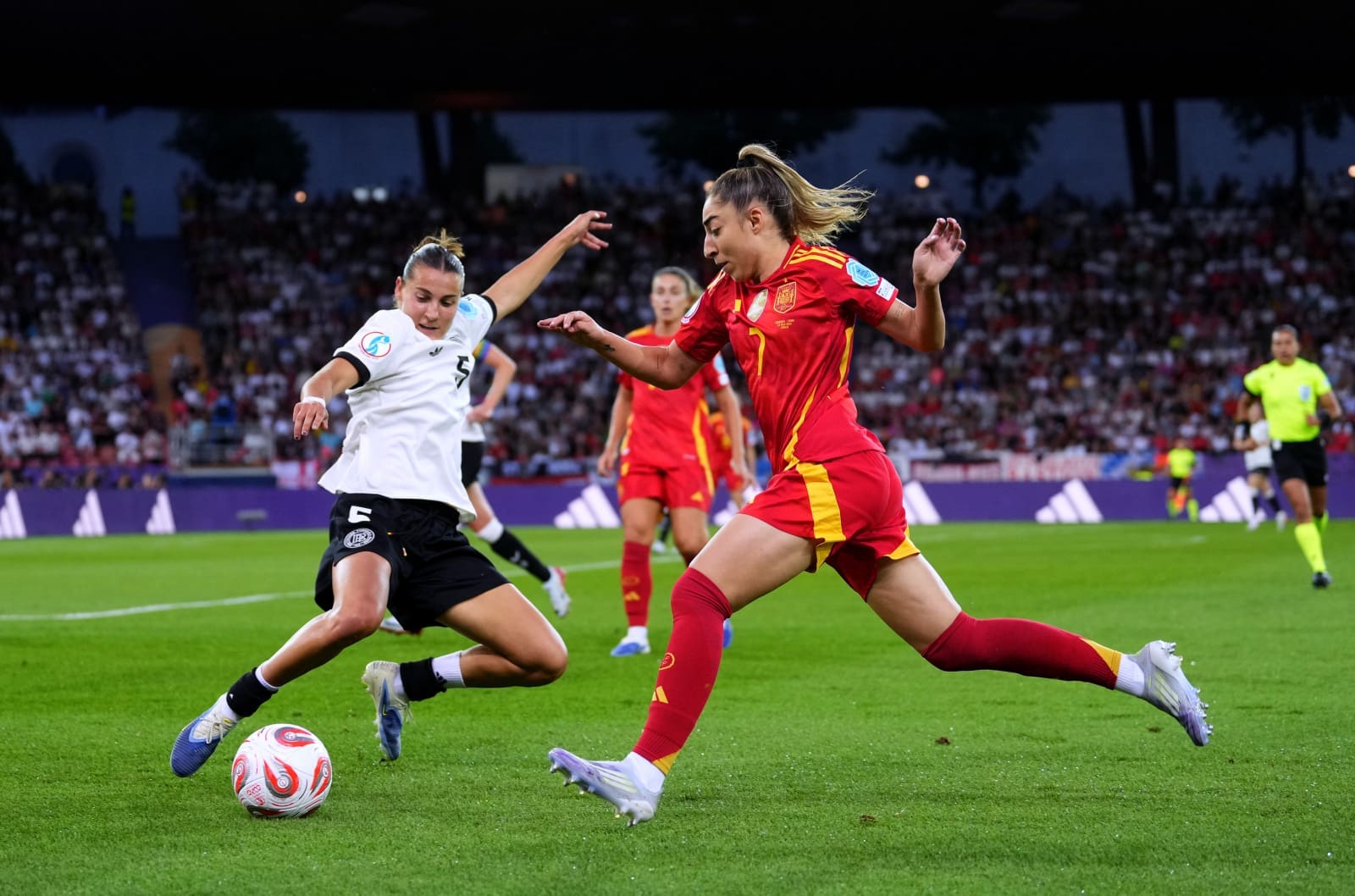 Olga Camora trying to round the defender. Mandatory Credit UEFA.com