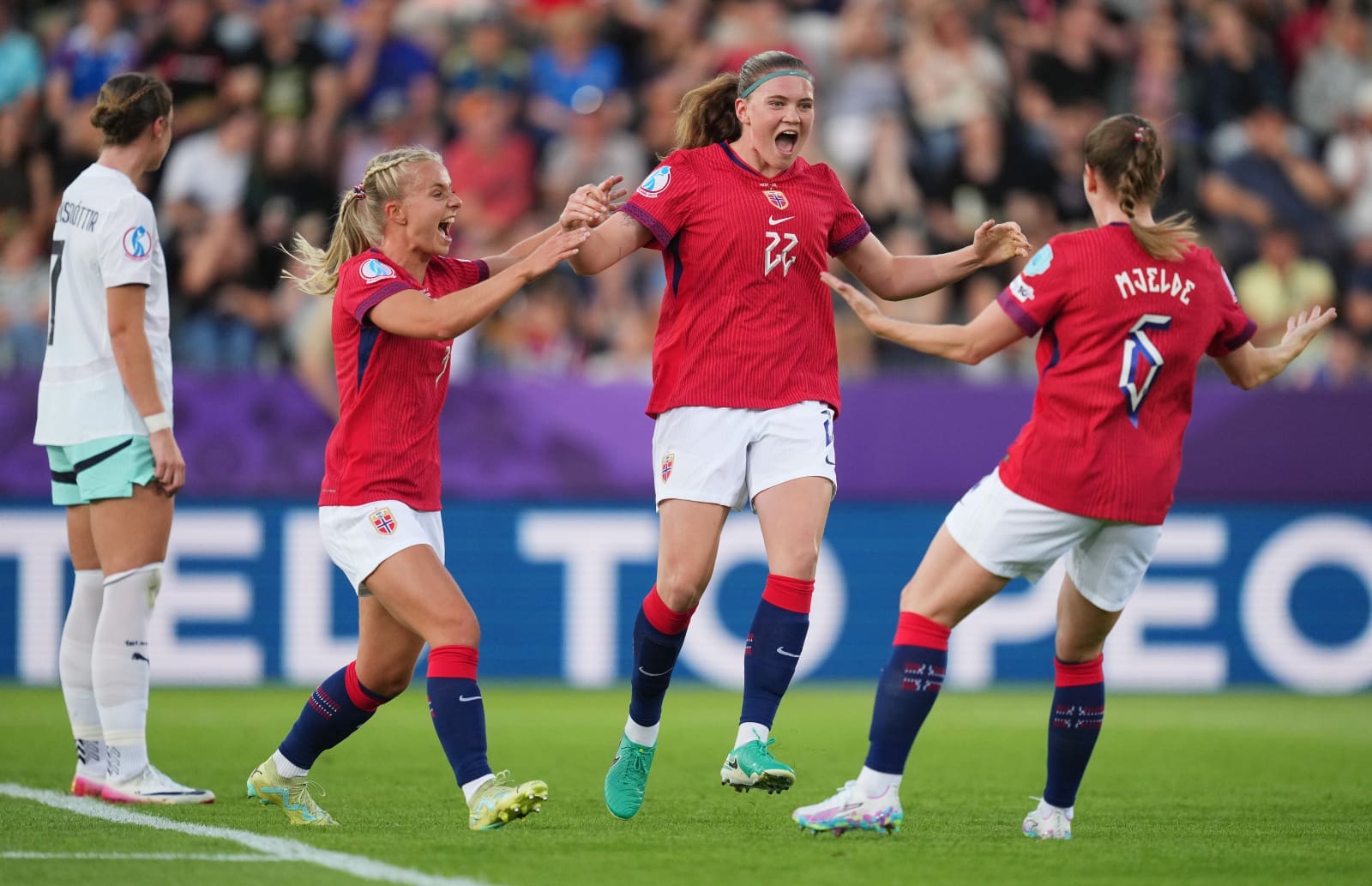 THUN, SWITZERLAND - JULY 10: Signe Gaupset of Norway celebrates with teammates Emilie Woldvik and Maren Mjelde after scoring her team's first goal during the UEFA Women's EURO 2025 Group A match between Norway and Iceland at Arena Thun on July 10, 2025 in Thun, Switzerland. (Photo by Alex Caparros - UEFA/UEFA via Getty Images)