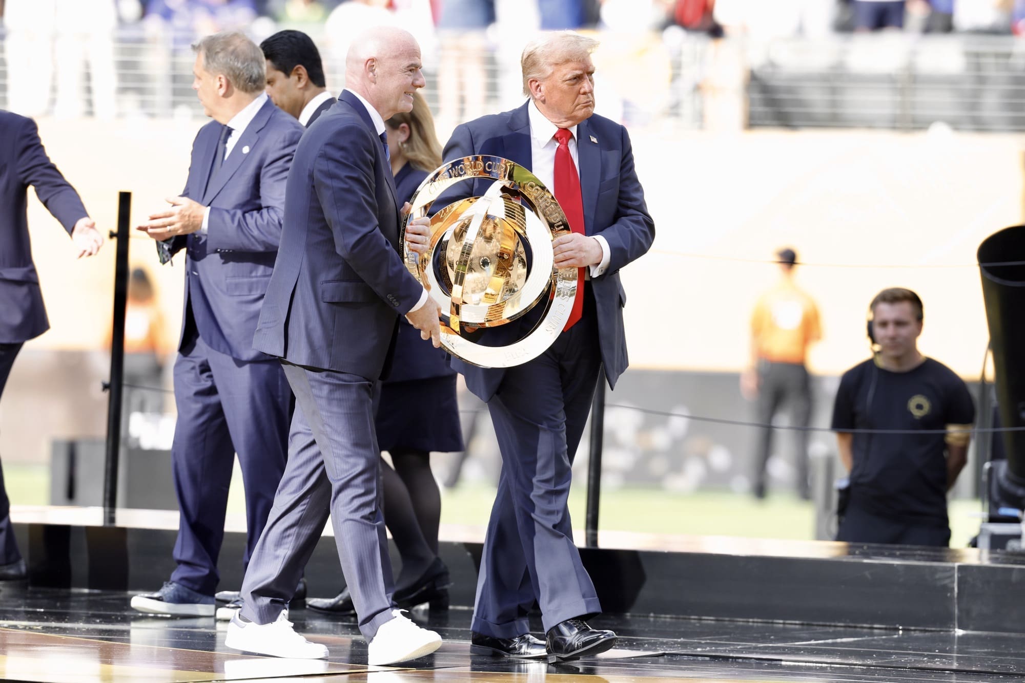 7/13/25, East Rutherford, New Jersey, MetLife Stadium, FIFA President Gianni Infantino and U.S. President Donald Trump hold the FIFA Club World Cup trophy after the 2025 final between Chelsea FC and Paris Saint-Germain. Mandatory Credit: Bad Dawg Sports/Jose Pichirilo