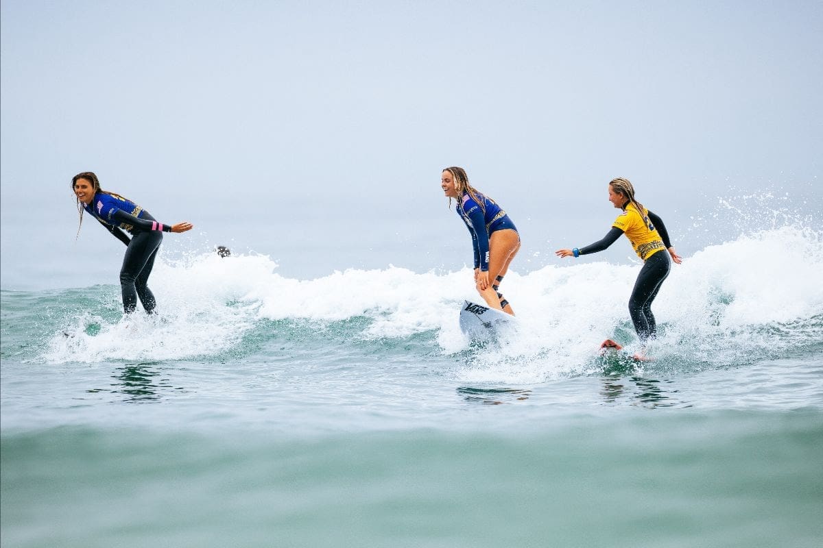Three surfers were catching waves before the event was canceled for the day.