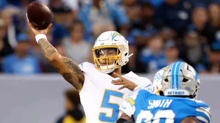 Trey Lance is throwing a pass against Detroit.