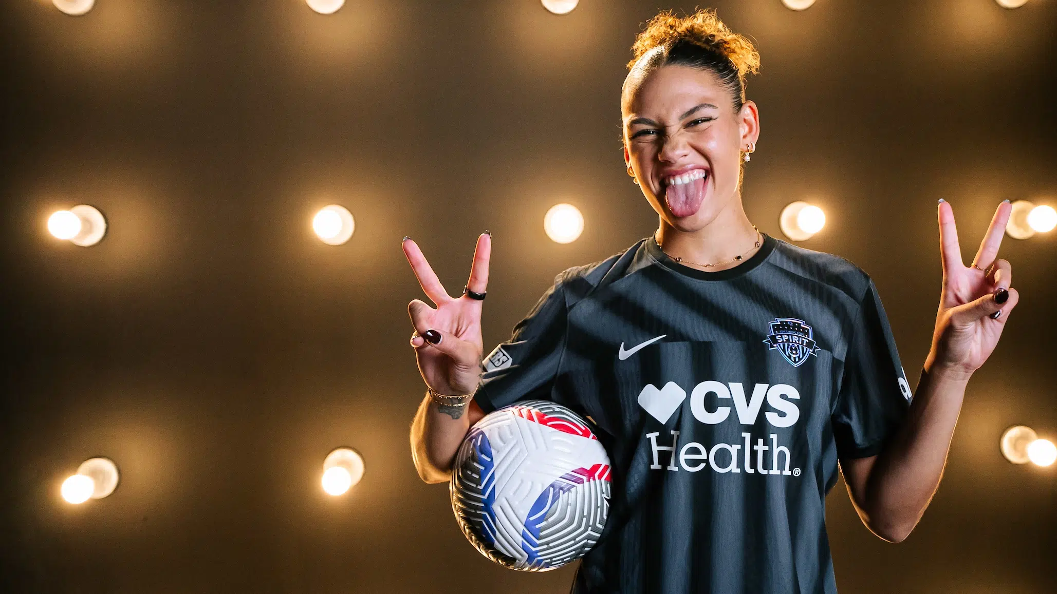 Trinity Rodman is posing in her Washington Spirit kit.