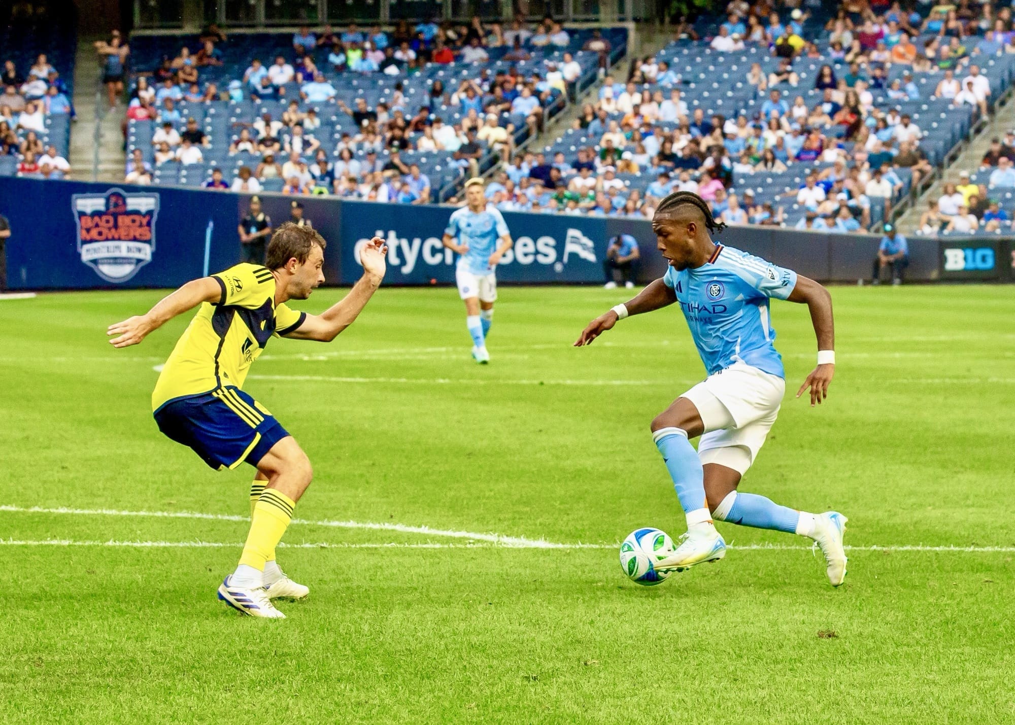 Andres Perea number 8 of New York City FC controls ball while pressured by Jack Maher number 5 of Nashville SC