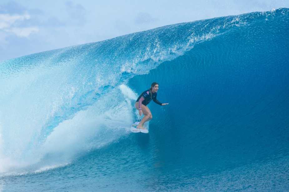 Caroline Marks surfing inside perfect barrel wave at Teahupo'o during Lexus Tahiti Pro