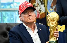 8/22/2025 The White House, Washington D.C. President Donald Trump Holds the FIFA World Cup Trophy in the Oval Office after announicing the draw will be at the Kennedy Center. Mandatory Credit Getty Images