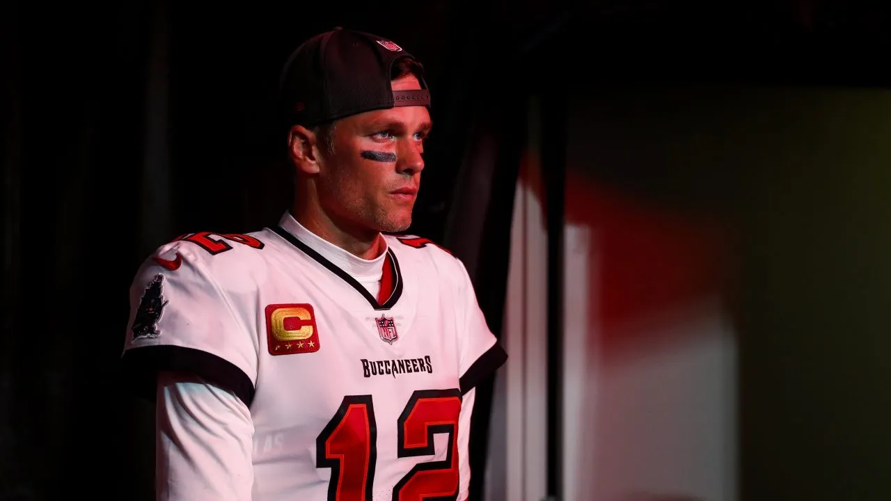 Tom Brady of the Tampa Bay Buccaneers (12) retires for the final time from the NFL. Brady is wearing his Buccaneers jersey in photo.