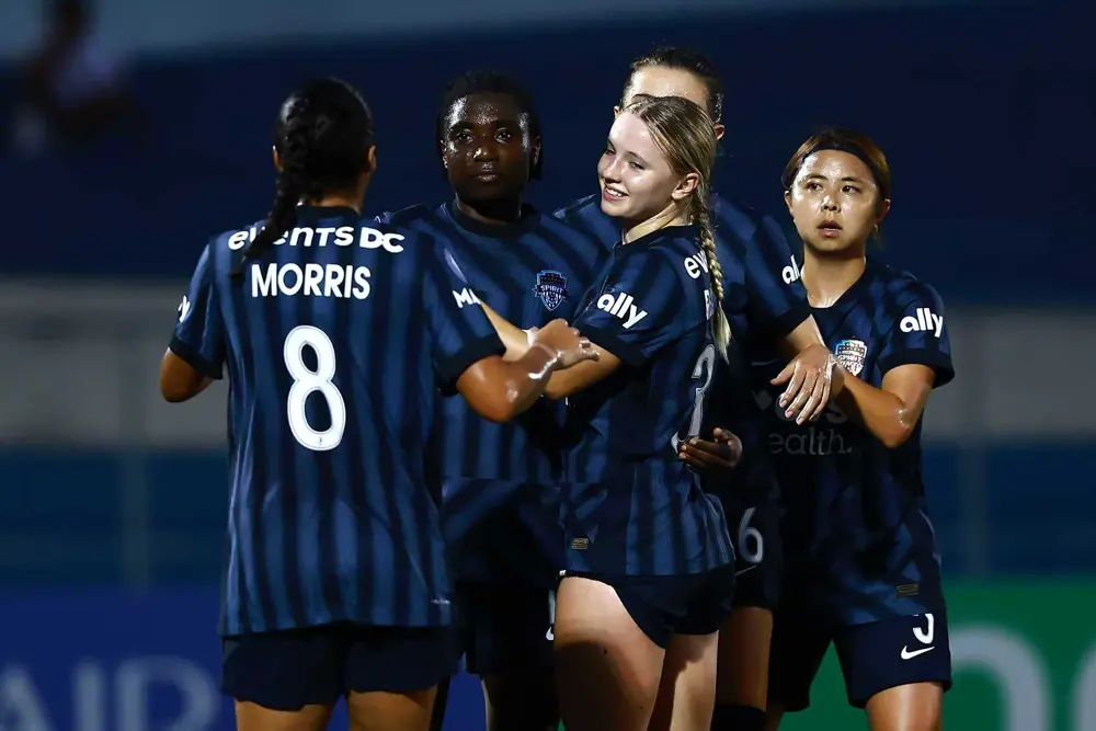 Rosemonde Kouassi, Chloe Ricketts, Morris and teammates celebrating opening goal in dominate performance.