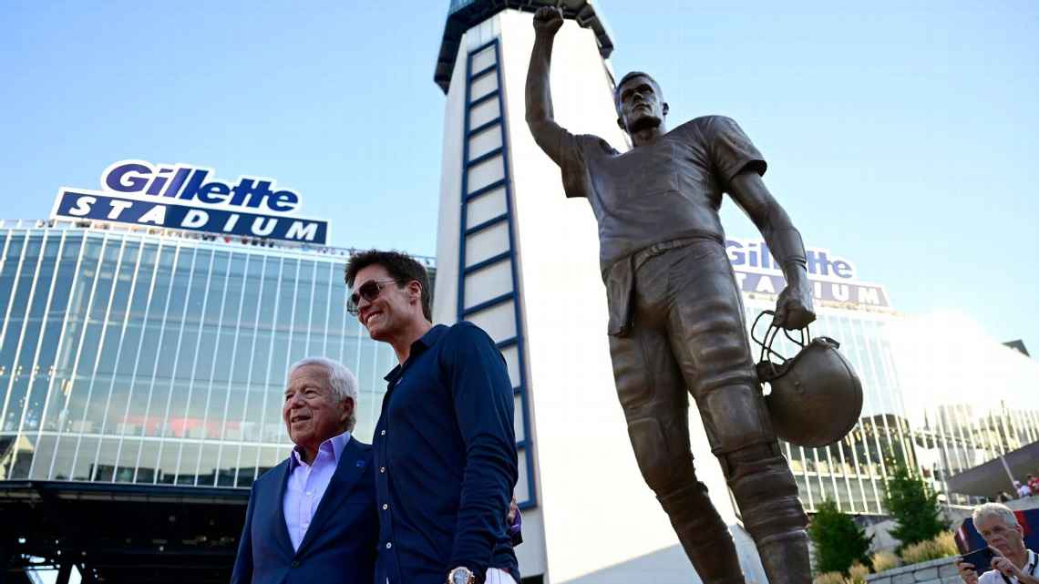 Tom Brady and Robert Kraft smiling at Tom Brady statue unveiling ceremony outside Gillette Stadium