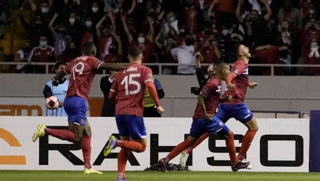 Costa Rica players celebrate their second goal against USMNT during World Cup qualifier at Estadio Nacional San Jose March 30 2022