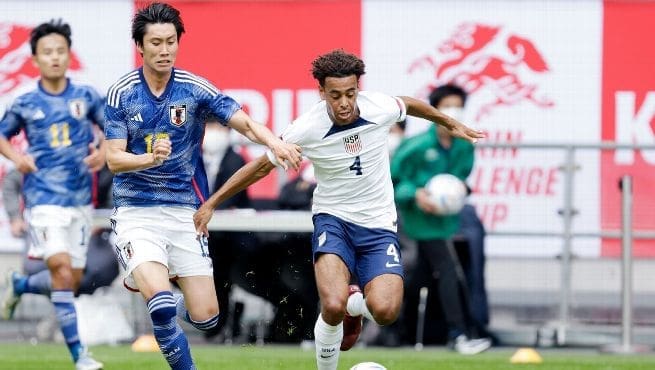 USMNT captain Tyler Adams (#4) battles for possession against a Japan player during the international friendly match