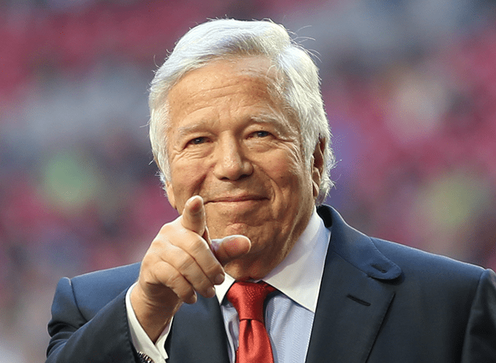 Robert Kraft New England Patriots owner points traight forward gesture at NFL stadium