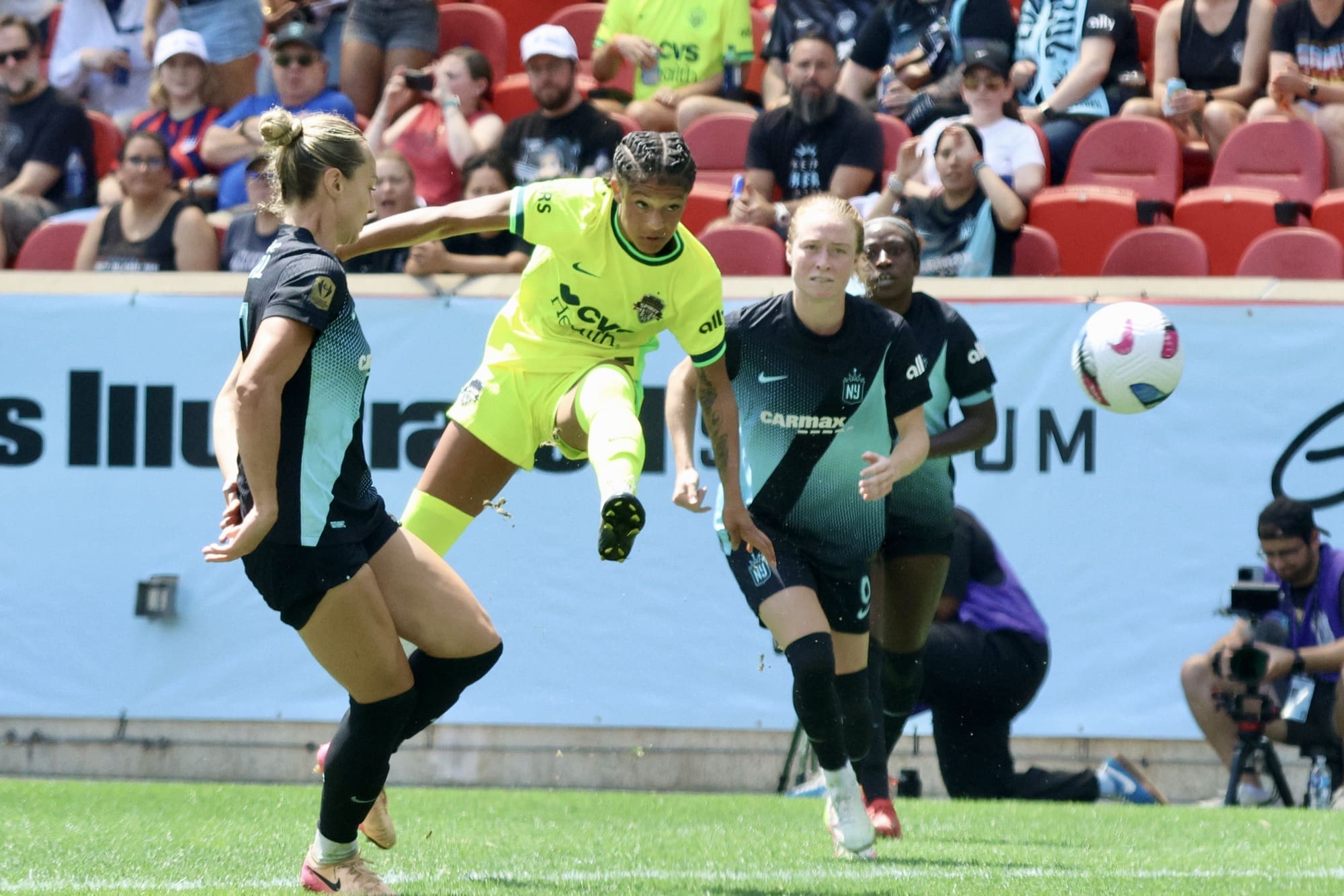 Croix Bethune splits two Gotham FC defenders during a match in Harrison, NJ.