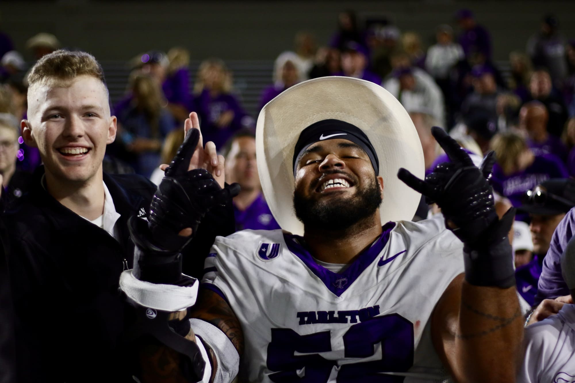 8/28/25, West Point, New York, Michie Stadium, Robert Rios (52) and Texans fans celebrate the victory over Army. Mandatory Credit: Jose Pichirilo/Bad Dawg Sports
