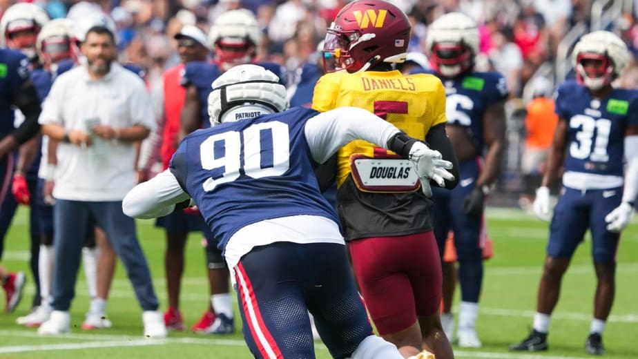 New England Patriots DT Christian Barmore (90) chases down Washington Commanders QB Jayden Daniels (5). Credit: David Silverman