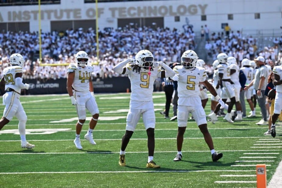 Georgia Tech defensive backs Omar Daniels (#9) and Clayton Powell-Lee (#5) celebrate together on the sideline during their upset victory over #12 Clemson